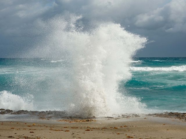 Waves push water up through the Anastasia limestone rocks at Blowing Rocks Preserve, shooting sea spray up to 50 feet in the air.